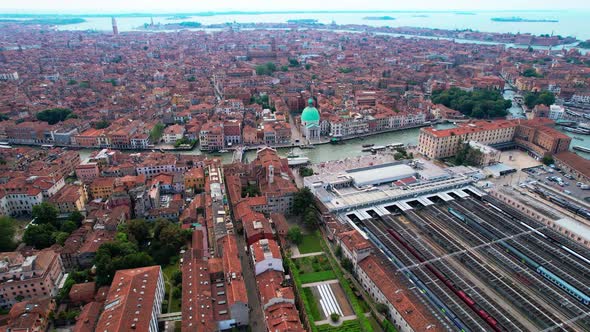 Flying Over Famous City Of Venice By The Grand Canal In Italy. Venezia Santa Lucia Train Station And alt