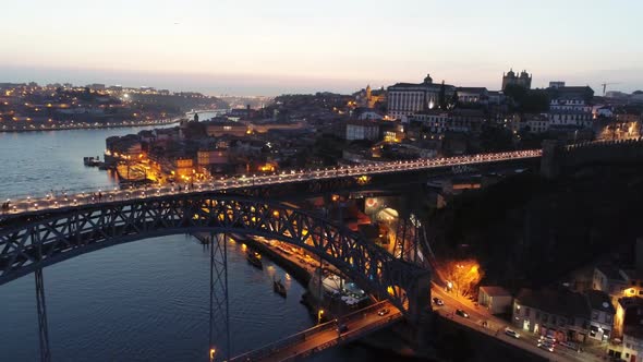 Aerial Shot Over Illuminated Luis I Bridge in Porto