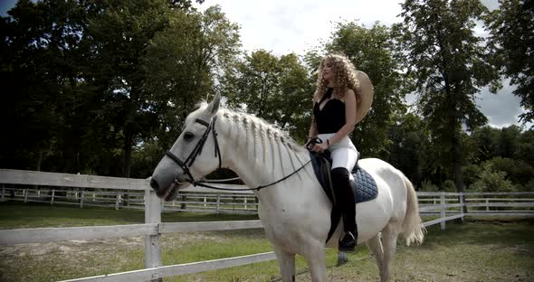 Beautiful Girl Saddled A White Horse alt