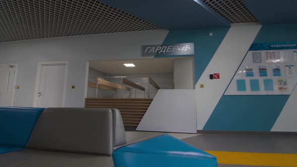 Cloakroom and Couch in Decorated Hallway of Sports Complex alt