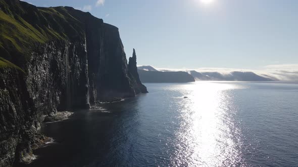 Drone Along Coastline Of Vagar With Trollkonufingur alt