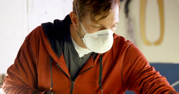 Man making surfboard 4k alt