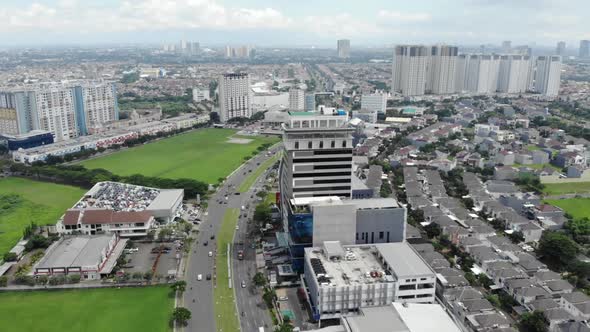 Aerial view of a small city with green areas