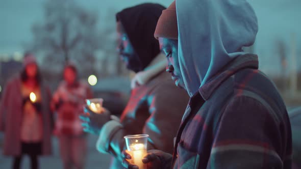 African American Men Gathering for Candlelight Vigil alt