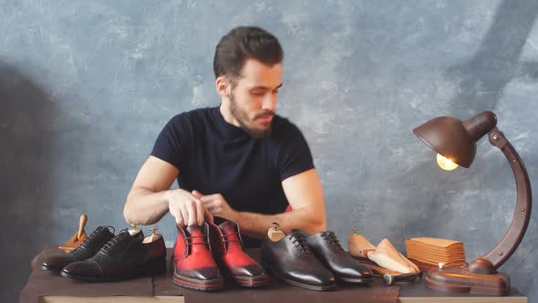 Handsome Shoe Designer Looking at Camera French Footwear Designer at Work