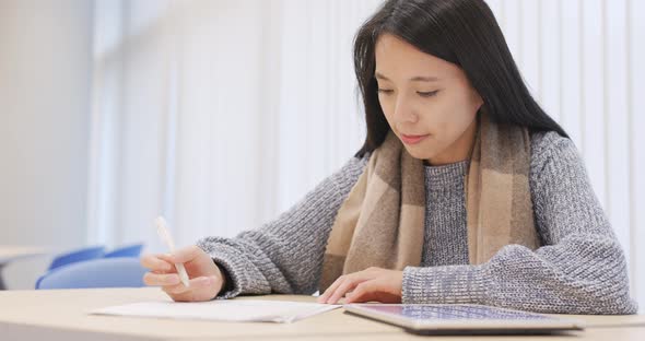 Student Doing Revision at Library alt
