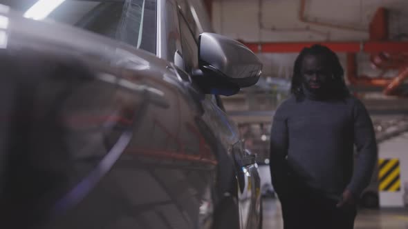 Upset Sad African American Black Man Approaching and Unlocking His Car Than Sit on Drivers Seat in alt