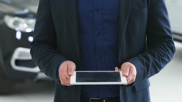 Image for Graphic Implements. A Man Uses a Flatbed Device with Futuristic Elements