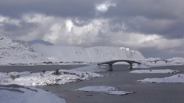 Bridge in the Winter Fjord and Clouds