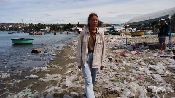 Young caucasian woman wearing eco friendly sustainable clothings walking barefoot sandals on tropica alt