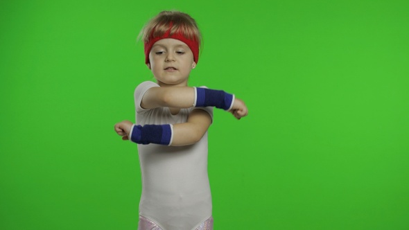 Young Cute Girl in Sportswear Making Fitness Gymnast Home Exercises. Workout for Kids. Sporty Child alt