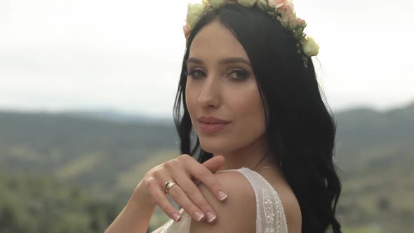 Beautiful and Lovely Bride Standing on the Mountain Hills. Woman in Love alt