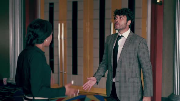 The Female Staff is Standing to Check the Ticket alt