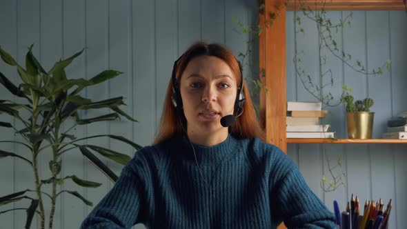 Head Shot View Woman Wearing Headphones Sit Indoors Wave Hand