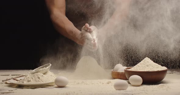 The Man Kneads The Dough And Shakes The Flour With His Hands