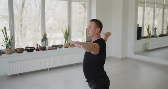 Professional Trainer Practices Flow Yoga in Private Class alt