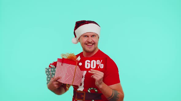 Man in Christmas Tshirt Showing Gift Boxes and 60 Percent Discount Inscriptions Banner Text Note alt
