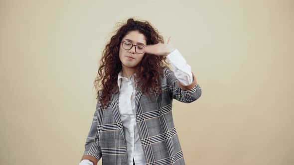 The Arrogant Young Woman Looks Insistently at Her with Both Hands Looking Into the Room alt