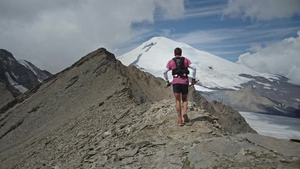 Following the Running Man on a Rocky Trail in a Big Mountains Epic Adventure Healthy Fitness