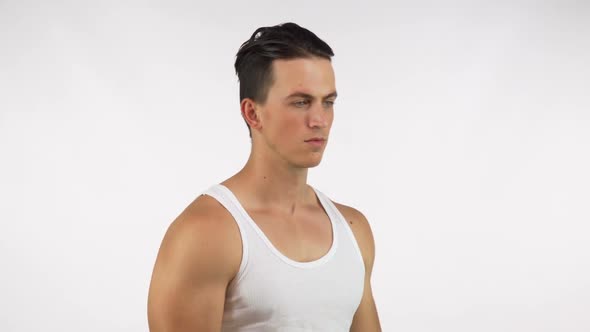 Handsome Muscular Man Flexing His Six-pack Abs, Lifting His Shirt 1080p alt