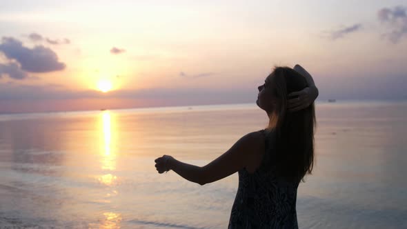 Beautiful Woman Enjoying Peaceful Seaside at Sunset