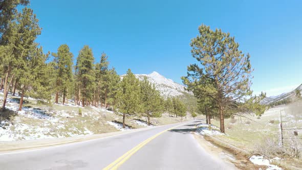 POV point of view -Driving through Rocky Mountain National Park in the Spring. alt