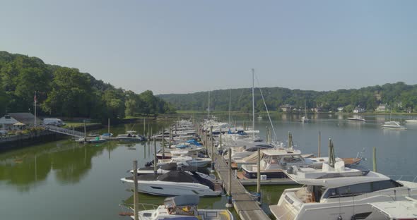 Backwards Pan of Boats Docked at a Marina in Cold Spring Harbor Long Island alt