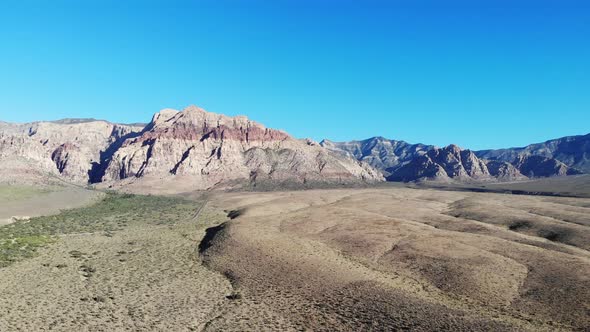 Red Rock National Conservation Area near Las Vegas, Nevada.  Rolling hills and morning shadows leadi alt