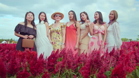 group of asian female friend woman walking in red blossom flower sunset moment alt