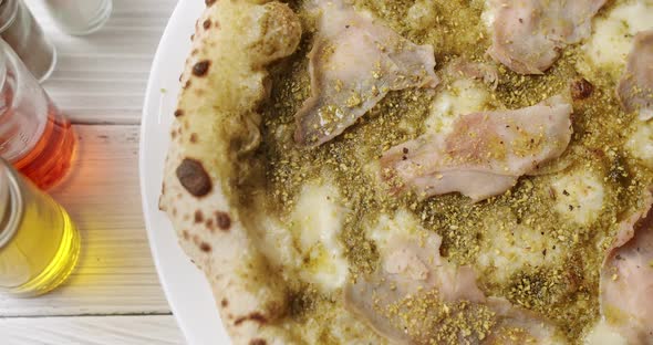 Pizza with Meat Pesto Cheese and Parmesan Fresh Out of the Oven Ready to Eat alt