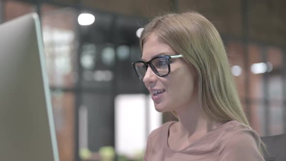 Portrait Shoot of Young Woman Doing Video Chat on Desktop alt