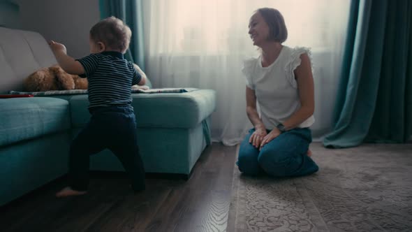 Cute Smiling Baby Boy Learning to Walk alt