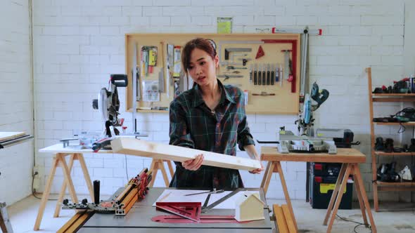 Architect woman design construction for built-in furniture project in workshop alt