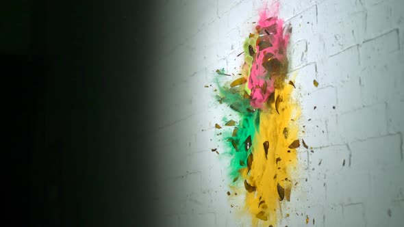 Smashing glass bottle of colorful sand, Slow Motion alt