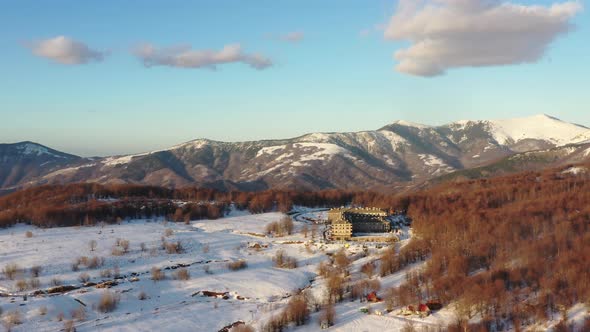 Aerial view at the mountain on a sunny winter day