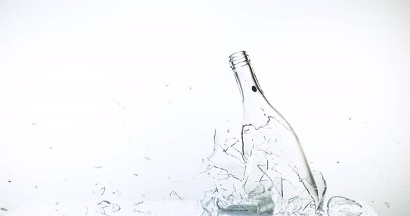 Bottle of Water Breaking a against White Background, Slow motion 4K