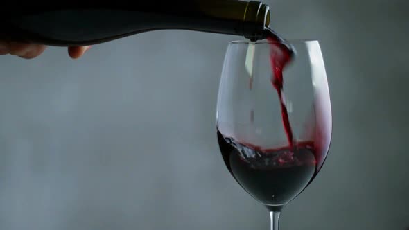 Red Wine Pouring Into Wine Glass. Close Up. Seamless Looping Cinemagraph Video