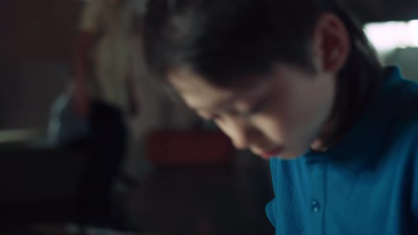 Schoolboy Surfing Social Media Communicating with Friends Using Tablet Close Up alt