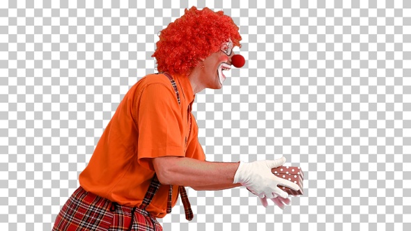 Male clown carrying a present, Alpha Channel alt