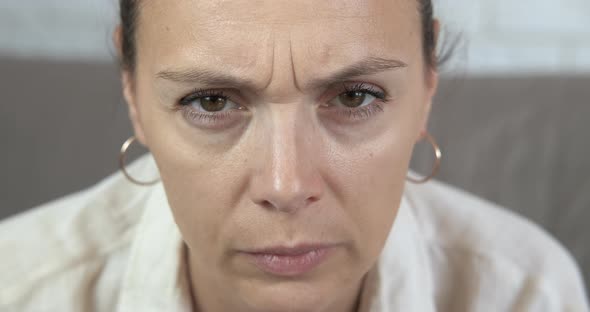 Emotional sad woman eyes. alt