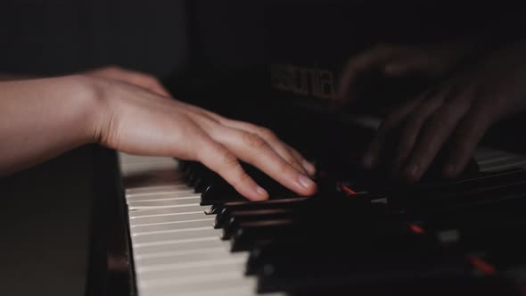 Close Up Fingers of Woman Pianist at the Rusty Piano Keys Arms Plays Solo of Music