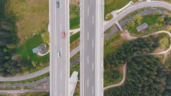 Aerial Top View of Highway Viaduct with Multilane Traffic in Mountains. Autobahn in Austria alt