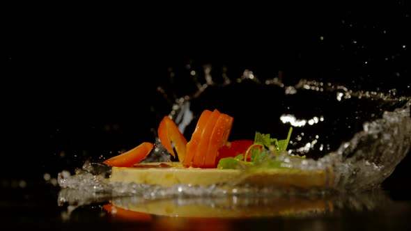 Sliced tomato and parsley leaf falling, Ultra Slow Motion alt