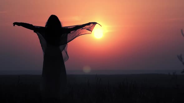 Silhouette Female Meditate at Sunrise alt