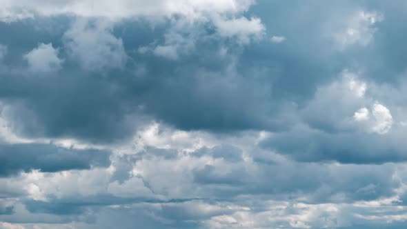 Summer Clouds Float Across the Blue Sky in Shuttles Shape Timelapse alt