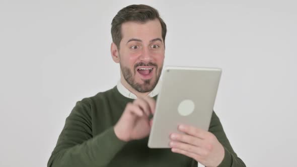 Portrait of Man Celebrating on Tablet in Office White Screen alt