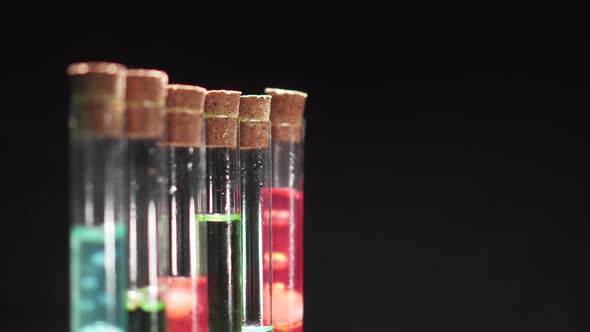 Glass Test Tubes with Boiling Multicolored Liquid alt