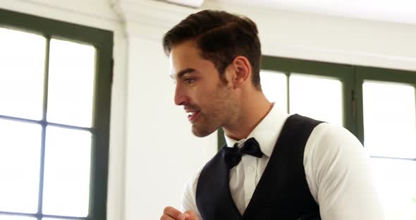 Waiter taking order of a cute couple alt