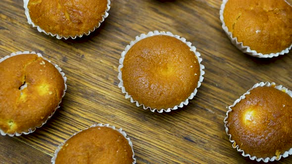 Top View Fresh Muffins On A Wooden Board, Pastries On A Wooden Tray. alt