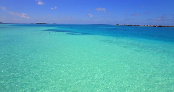 Aerial drone view of a scenic tropical island in the Maldives alt